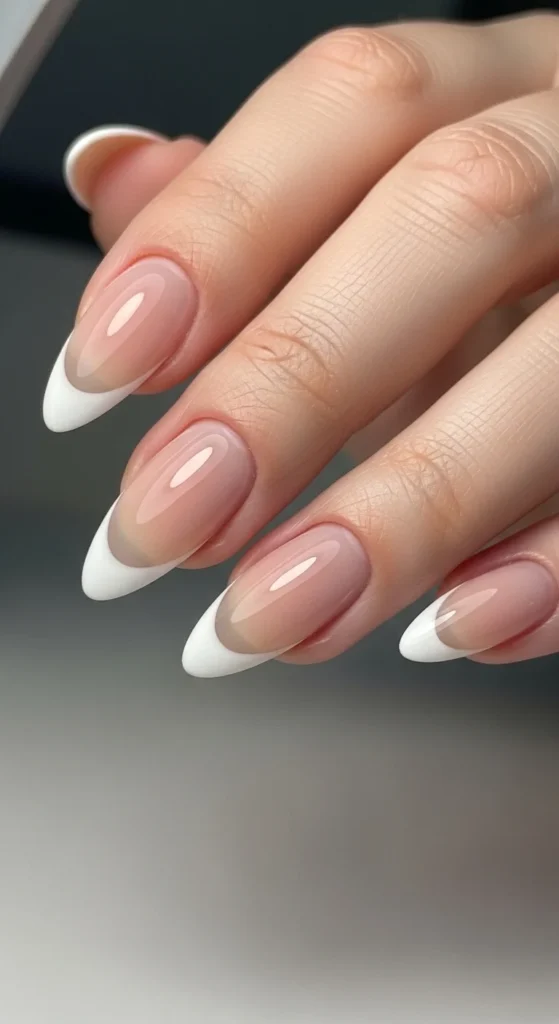 13. Almond-Shaped French Tips for Everyday Balance.webp