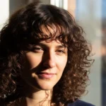 23 Trendy Curly Hairstyles with Bangs That Add Instant Personality.webp