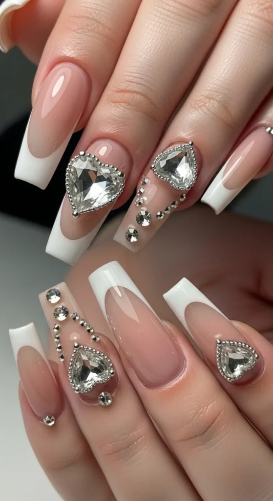 11. 3D Heart Charm French Nails.webp