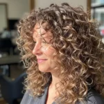 20 Voluminous Layered Curly Haircuts That Boost Body.webp