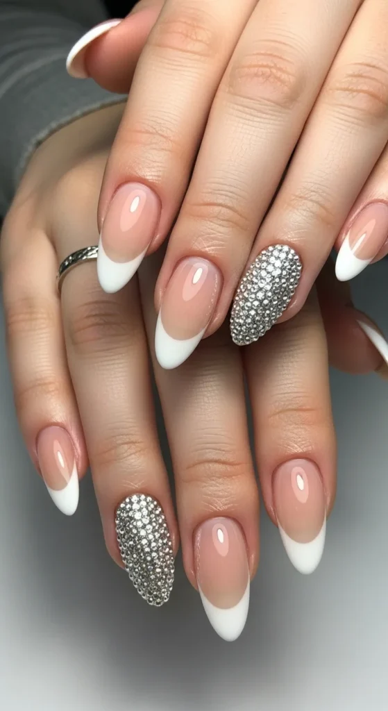 2. Almond French with a Single Gem Accent Nail.webp