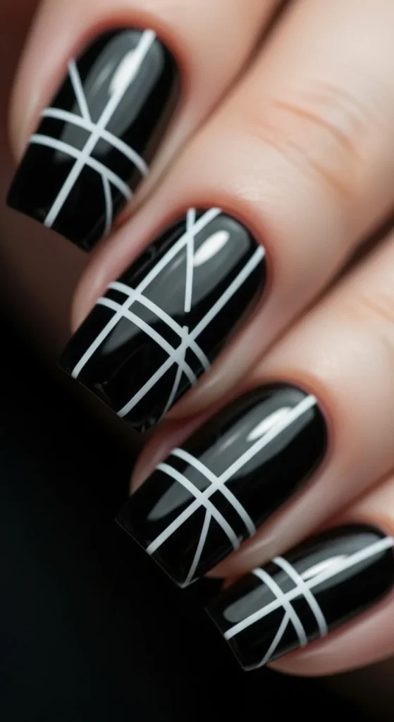 20. Black Nails with Thin Geometric Shapes.webp