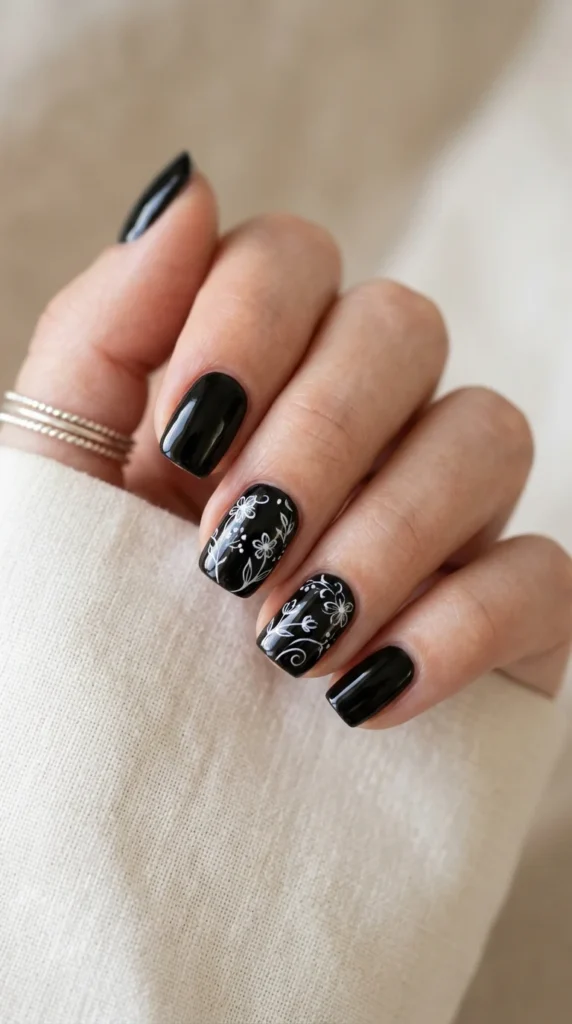 14. Black Floral Line Art Nails.webp