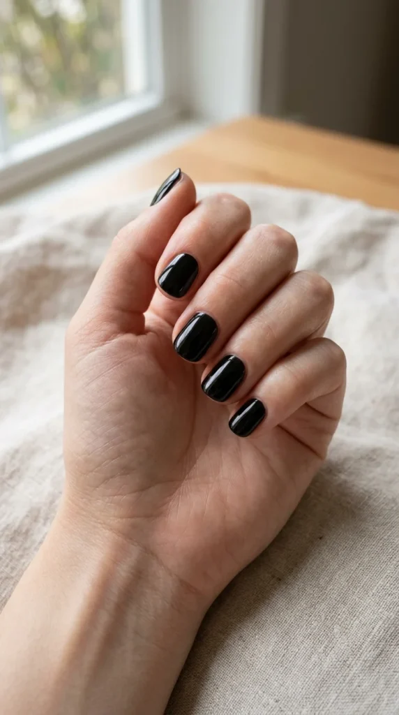 15. Short Glossy Black Office Nails.webp