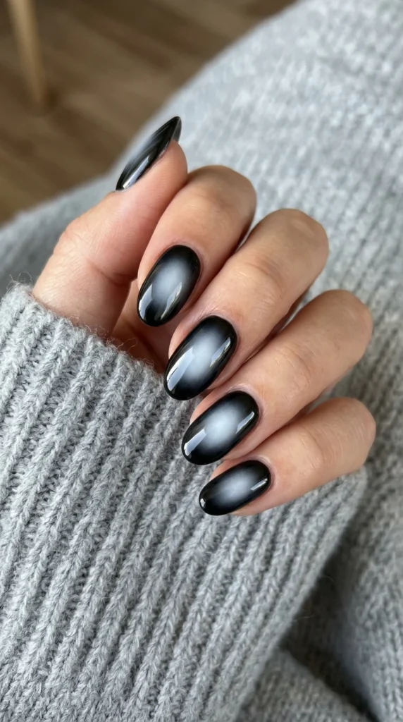 8. Black Aura Nails with Soft White Glow.webp