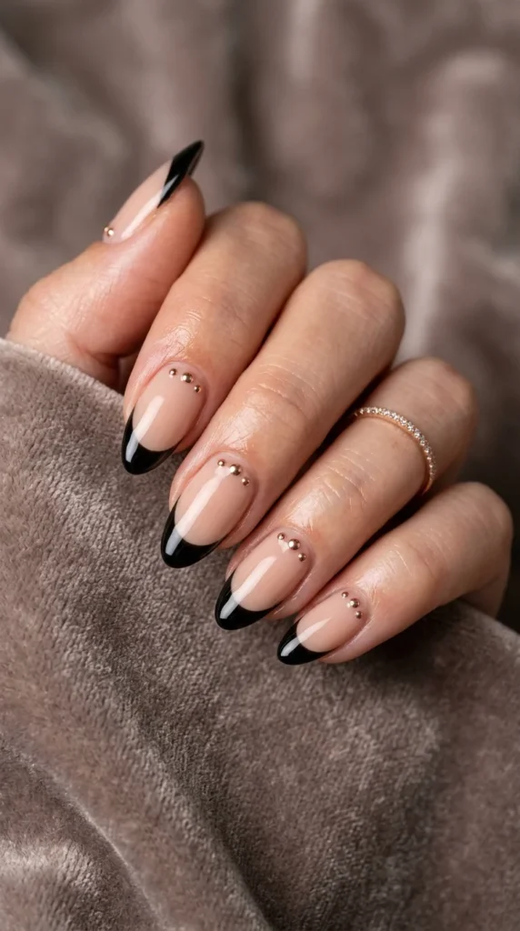 15. Black French Tips with Tiny Metallic Studs.webp